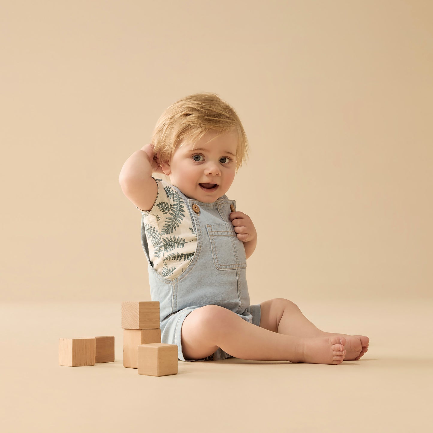 Behind The Trees - Light blue denim overalls with button details on a white background - Wilson + Frenchy - Organic Denim Overall