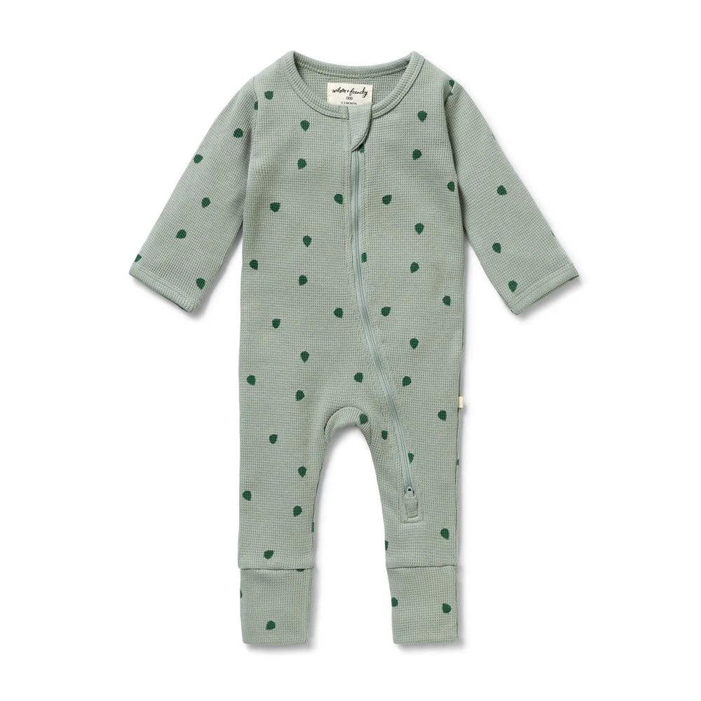Behind The Trees - Green baby onesie with a subtle pattern on a white background - Wilson + Frenchy - Organic Waffle Zipsuit - Tumbletwig