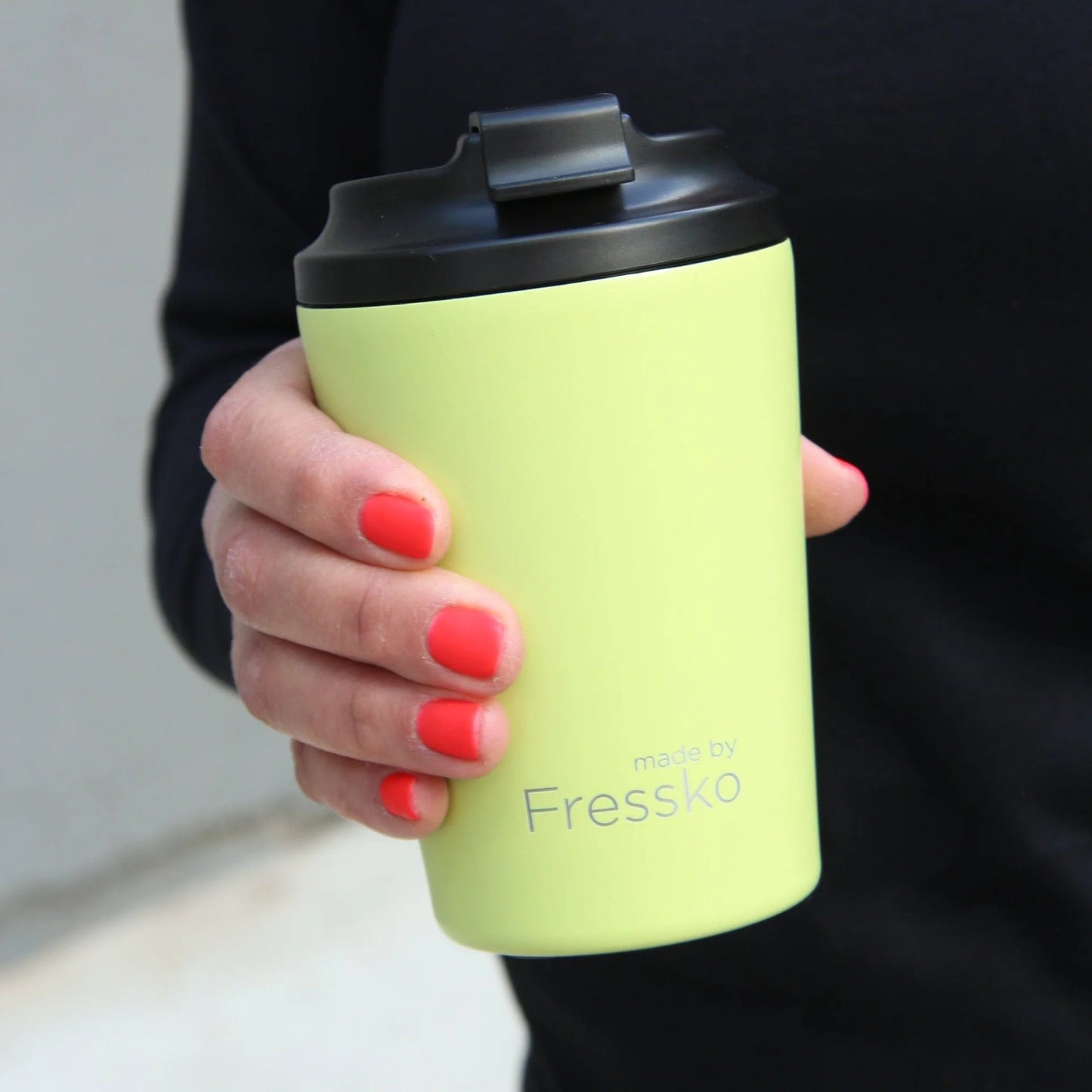 Behind The Trees - Yellow travel mug with black lid and white label on a white background - Made By Fresko - Reusable Coffee Cup - Camino 340ml/12oz - Sherbet