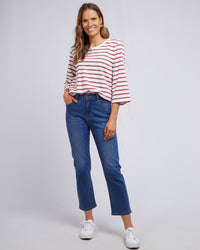 Behind The Trees - Woman wearing a striped shirt and blue jeans on a plain background - Elm - Ada Straight Leg Jean - Washed Blue Denim