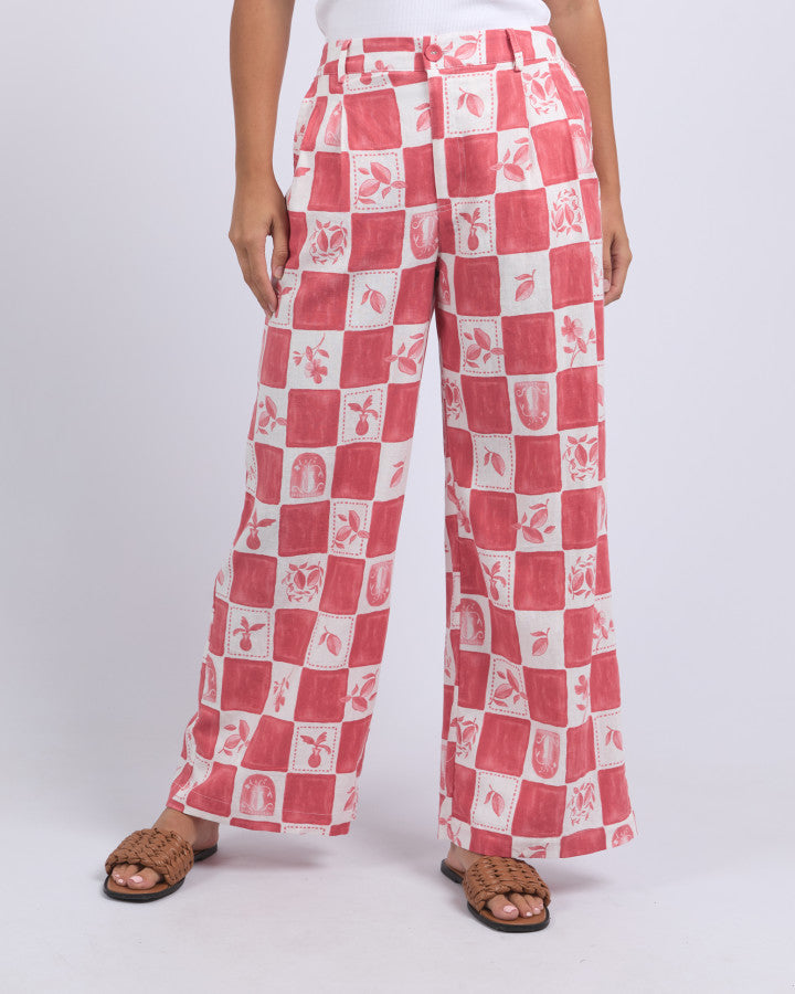 Behind The Trees - Red and white checkered pants worn by a person on a white background - Foxwood - Biarittz Pant - Crimson Print