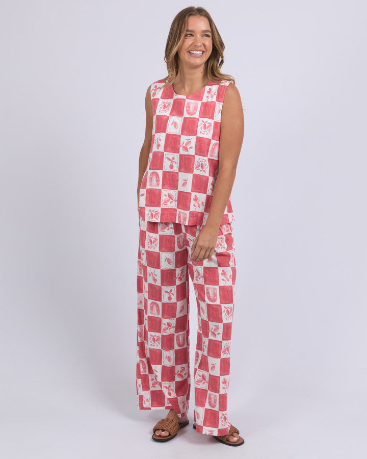 Behind The Trees - Red and white checkered pants worn by a person on a white background - Foxwood - Biarittz Pant - Crimson Print