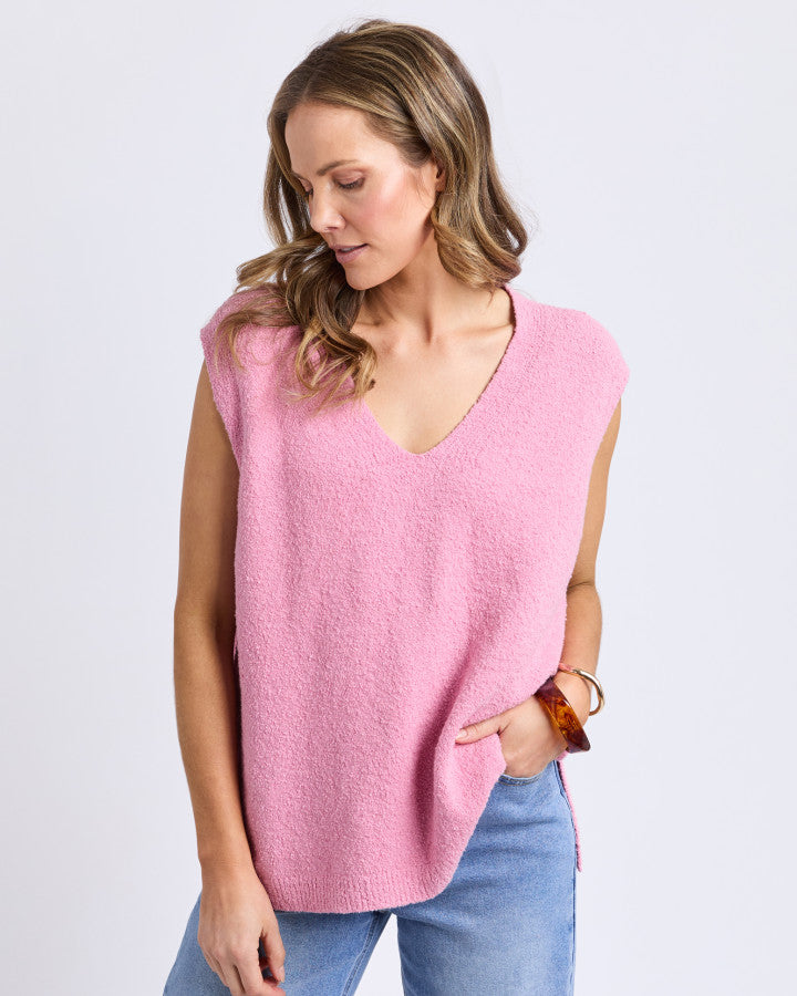 Behind The Trees - Woman wearing a pink sleeveless top and blue jeans on a white background - Elm - Bowie Knit Vest - Quartz Pink