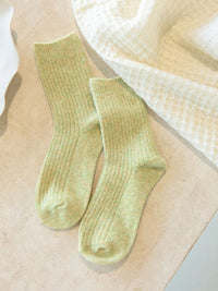 Behind The Trees - Pair of light green socks on a neutral background - Bed & Butter - The Comfiest Socks - Light Sage