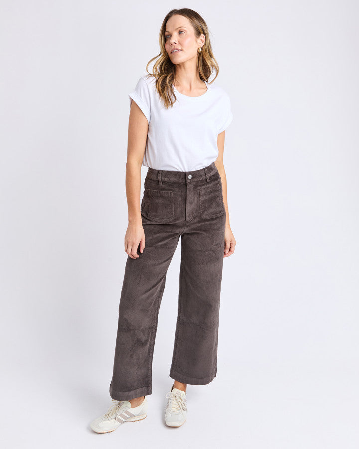 Behind The Trees - Person wearing brown corduroy pants on a white background - Foxwood - Henrietta cord Pant - Coffee Bean