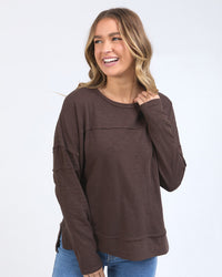 Behind The Trees - Woman wearing a brown sweatshirt against a white background - Foxwood - Jayne Throw On Top - Coffee Bean