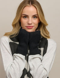 Behind The Trees - Woman wearing a black and white patterned scarf with a neutral background - Tiger Tree - Fingerless Ribbed Mittens - Black