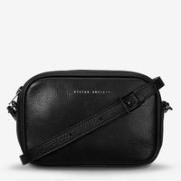 Behind The Trees - Black leather crossbody bag with 'STATUS ANXIETY' branding on a white background - Status Anxiety - Plunder Bag - Black