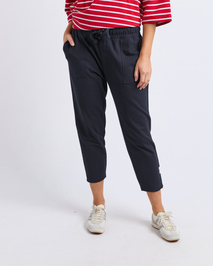 Behind The Trees- Person wearing navy pants and a red and white striped shirt on a white background
Elm - Sutton- Track Pant- Navy